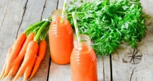 how much carrot juice is safe to drink daily